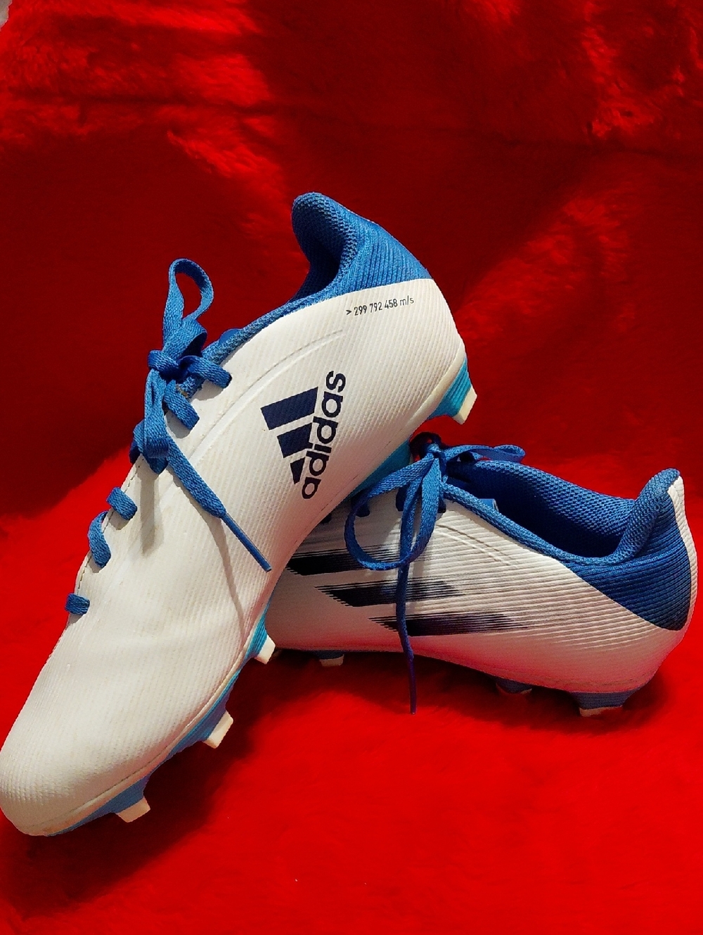 adidas White and Blue Soccer Cleats with Lace-Up Design